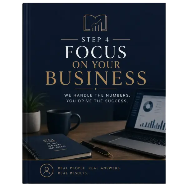 Business book cover reading 'Step 4: Focus on Your Business' on a dark desk setup with a notebook, pen, mug and a laptop showing charts on screen